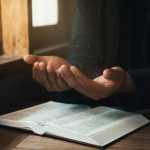 Person praying briefly in the morning beside a window with sunlight, seeking God’s presence for the day.