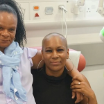 Cancer patient praying in a hospital room during morning devotion, asking God for healing and strength.