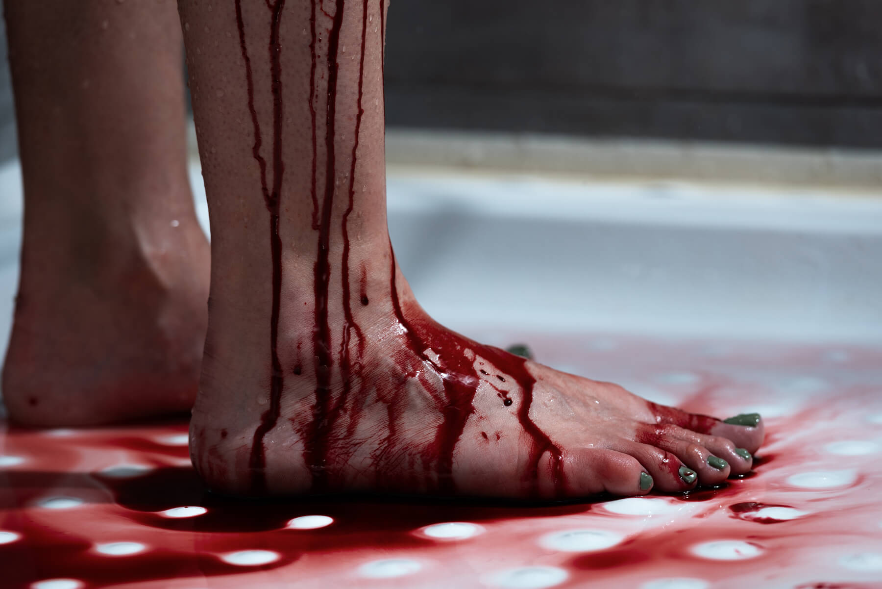 cropped view of barefoot bleeding woman in bathroo 2023 11 27 05 03 45 utc