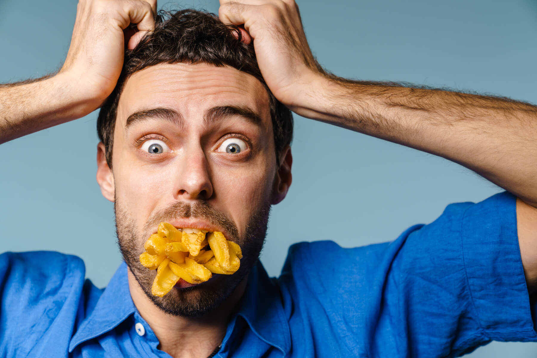 shocked guy grabbing his head while posing with fr 2023 11 27 04 56 16 utc