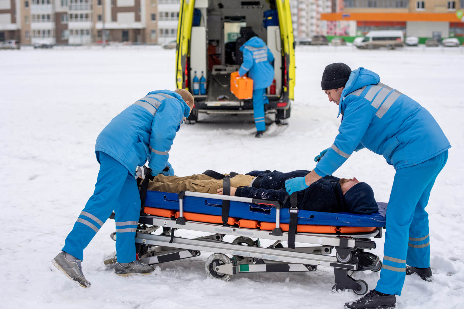 two paramedics in blue workwear fixing unconscious 2023 11 27 04 51 49 utc
