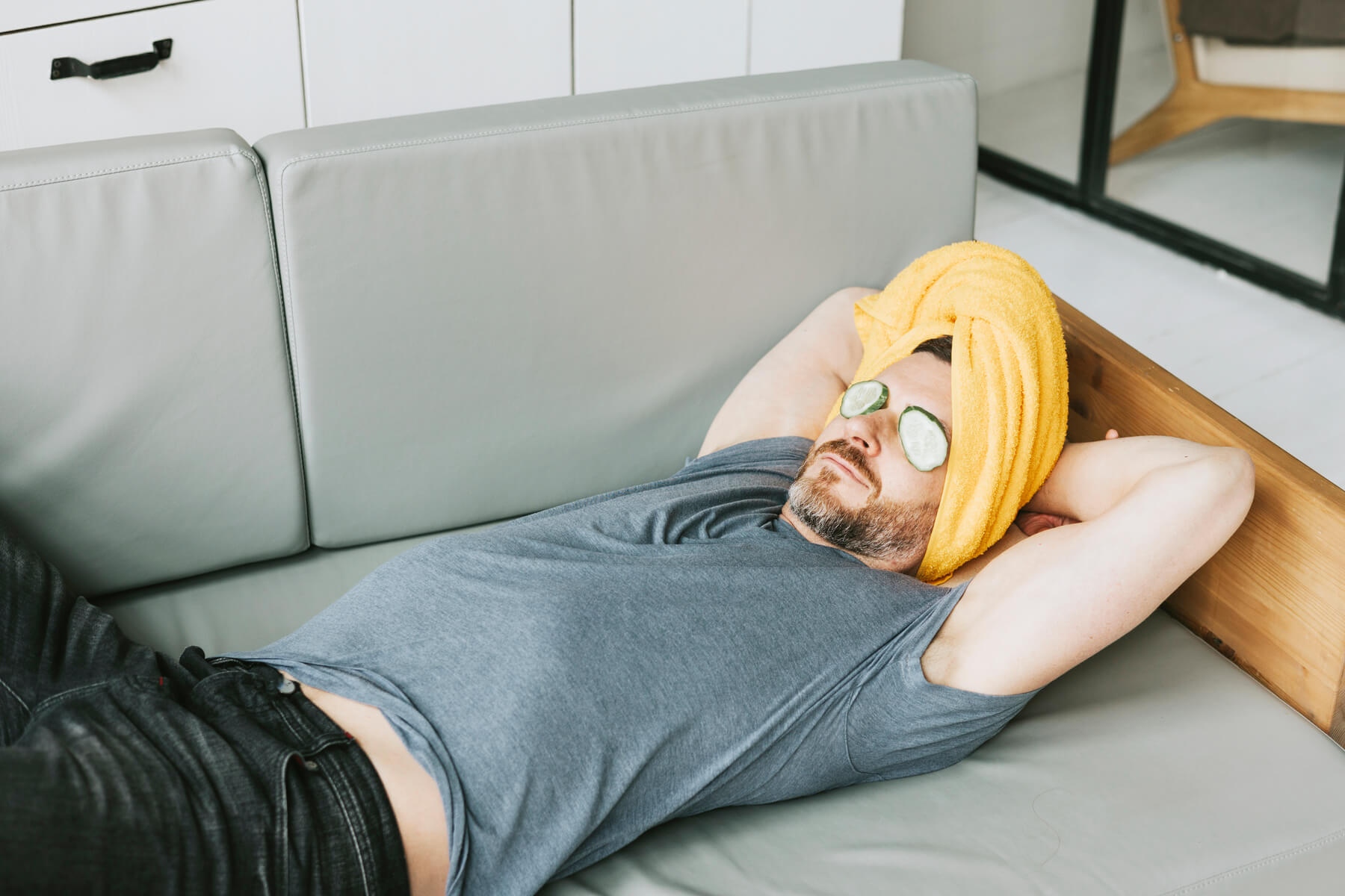 young handsome man is lying on sofa in living room 2024 01 31 18 37 09 utc